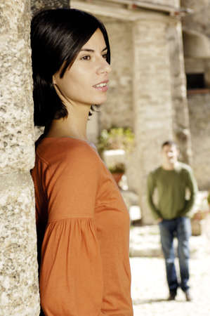 woman standing on a wallの写真素材