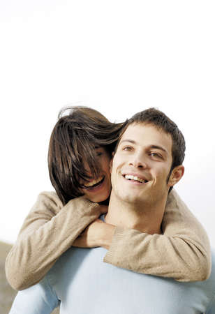happy couple piggy backの写真素材