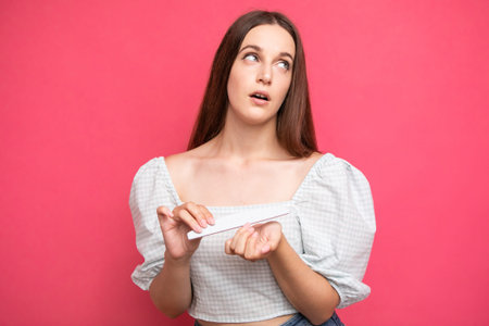 Arrogant facial expression girl rolled her eyes, pink background, emotions