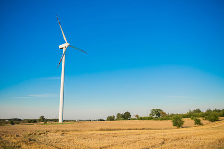 Windmills for electricity generation. Green energy concept. Background with copy space for text....