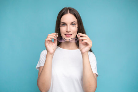 Beautiful smiling woman wearing glassesの写真素材