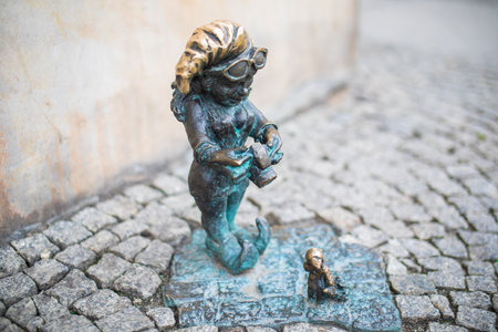 Poland, Wroclaw - April 2022. Dwarf, gnome, famous small statues in Wroclawのeditorial素材