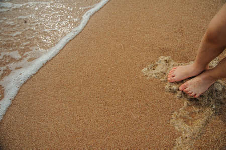 legs of child on the sand beach red sea nice tropical viewの写真素材