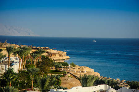 red sea white houses tropical location paradise palms green treeの写真素材