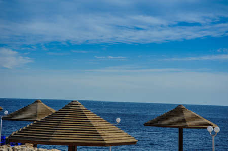 sunshade turquoise sea blue sky beautiful view in tropical locationの写真素材