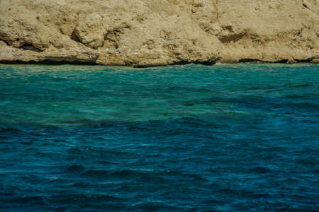 mountains in beautiful turquoise red sea nice beach with gold sandの写真素材