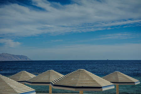 sunshade turquoise sea blue sky beautiful view in tropical locationの写真素材