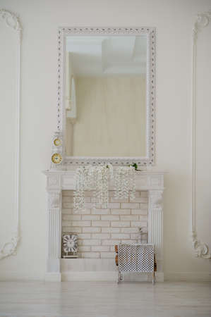 vintage old empty white studio room with mirror and bricks decorationの写真素材