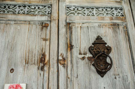 The Old wood brown Door with Cracked Paint Backgroundの写真素材