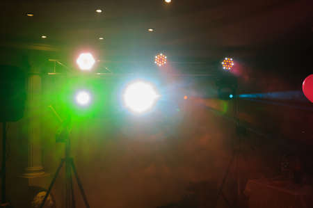 Disco lights and show. Concept about entertainment and party. Balloons and smokeの写真素材