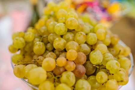 green white grapes isolated on the tableの写真素材