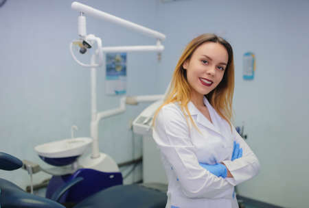 portrait of smile young female dentist in dental treatment roomの写真素材