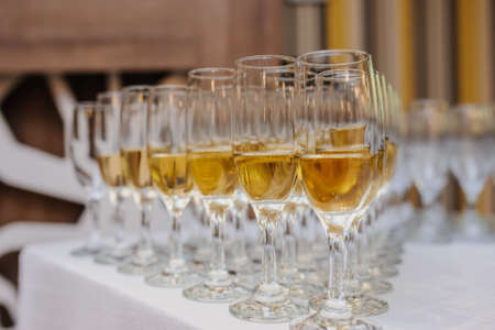 Composition of champagne glasses on the table. The reception on the wedding partyの写真素材