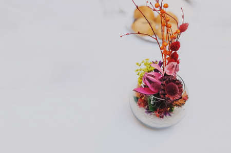 Bouquet of dried flowers in vase on light background top viewの写真素材