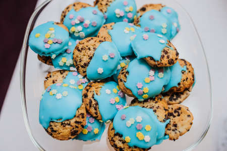 Cookies with blue cream in a  glass bowl on partyの写真素材