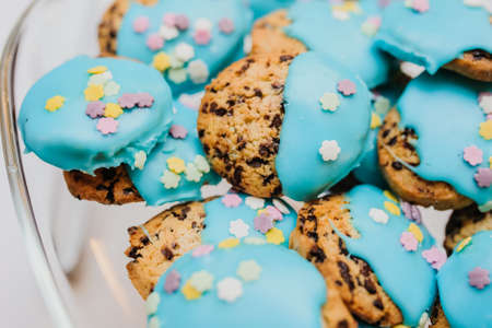 Cookies with blue cream in a  glass bowl on partyの写真素材