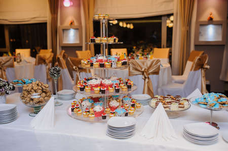 candy bar composition of sweets: cupcakes, cookies, and fruitsの写真素材