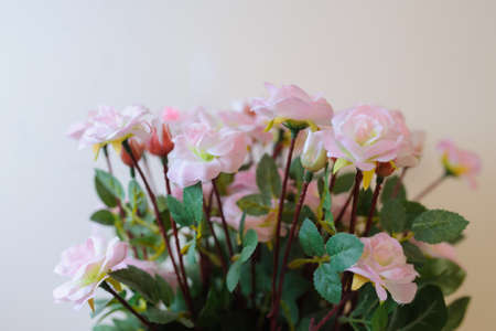Artificial flowers of pink Roses for decoration, beautiful plastic bouquetの写真素材
