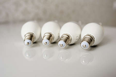 LED energy saving bulb, light-emitting diode on the tableの写真素材