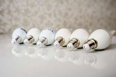 LED energy saving bulb, light-emitting diode on the tableの写真素材