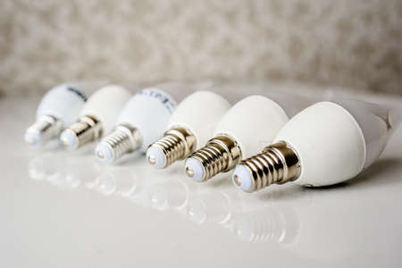 LED energy saving bulb, light-emitting diode on the tableの写真素材