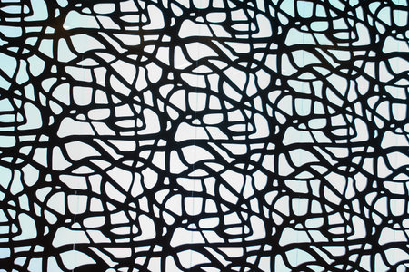 Wall from metal black web on white light background