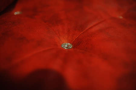 Red leather background with diamond buttons luxury vintage textureの写真素材