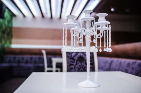 Old retro vintage white candlestick in modern interiorの写真素材