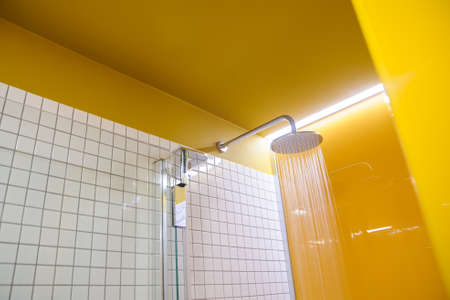 shower in the bathroom close up modern yellow styleの写真素材