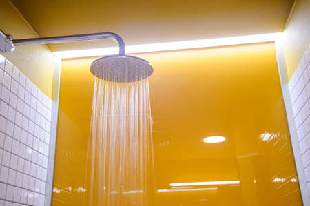 shower in the bathroom close up modern yellow styleの写真素材