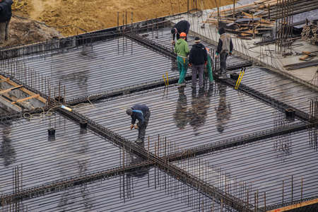 The group of workers working at a construction site. Top viewの写真素材