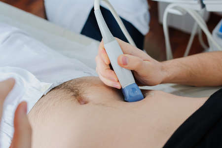 abdominal ultrasound examination in medical office usgの写真素材