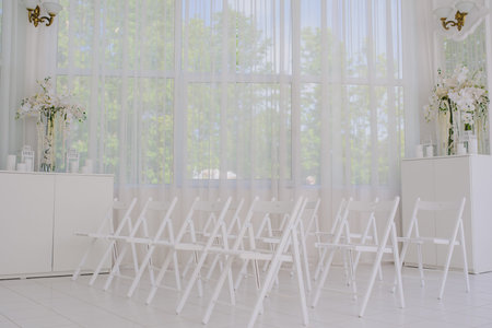 Wedding decorations with flowers ceremony and seating guests in white romantic style