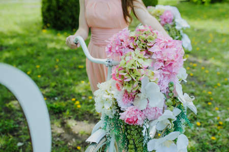 Wedding composition decoration in old vintage romantic style. Bride with white bikeの写真素材