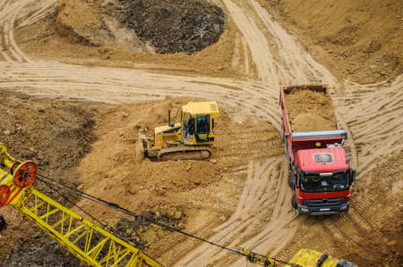 bulldozer and truck at the construction siteの写真素材