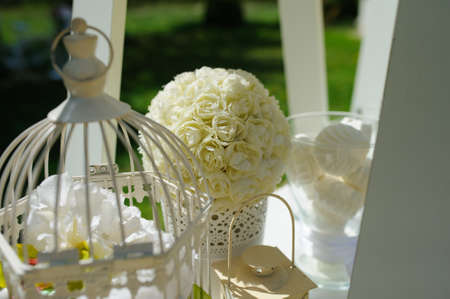 Wedding composition decoration with white roses in a metal bucket and cageの写真素材