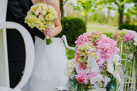Wedding composition decoration in old vintage romantic style. Bride with white bikeの写真素材