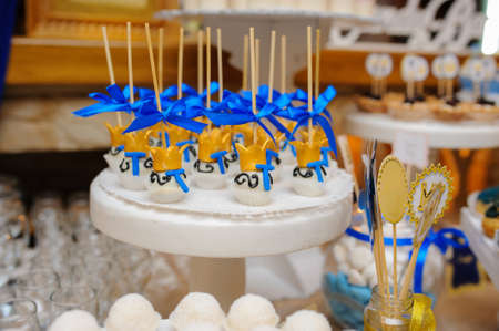 Sweet cookies with white cream  decorated with gold, royal style の写真素材