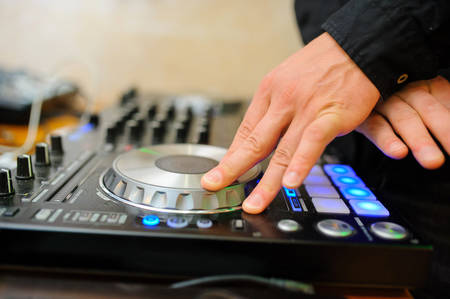 Dj mixes the track in the nightclub at partyの写真素材