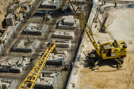 Construction worker working hard on a construction site. top viewの写真素材