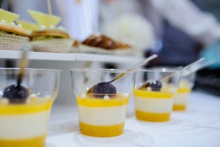 Top view of fruit jelly in glasses and sweet cookiesの写真素材