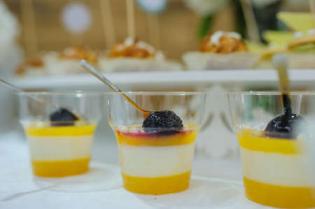 Top view of fruit jelly in glasses and sweet cookiesの写真素材