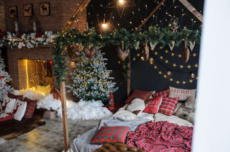Vintage style interior: christmas tree, artificial snow, nice bedの写真素材