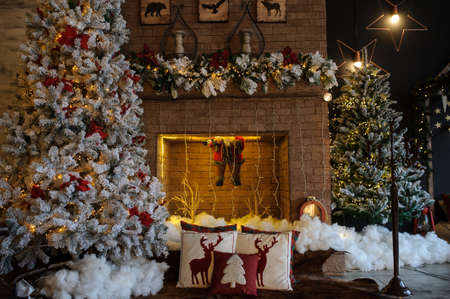 close up composition of christmas studio room with fireplace and tree.の写真素材