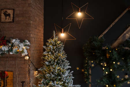 crop of modern style interior of fireplace with christmas tree and presentsの写真素材