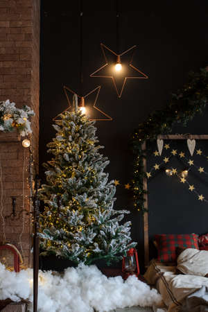 crop of modern style interior of fireplace with christmas tree and presentsの写真素材