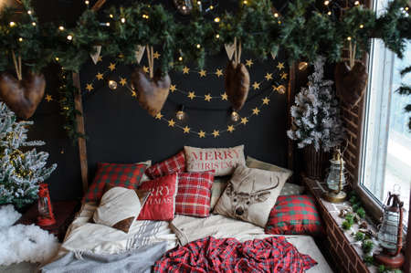 Vintage style interior: christmas tree, artificial snow, nice bedの写真素材