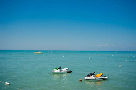 motor boats in the seaside in summer green waterの写真素材