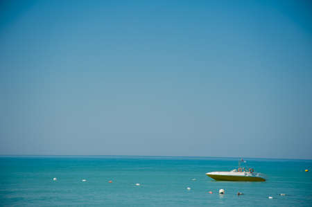 motor boats in the seaside in summer green waterの写真素材