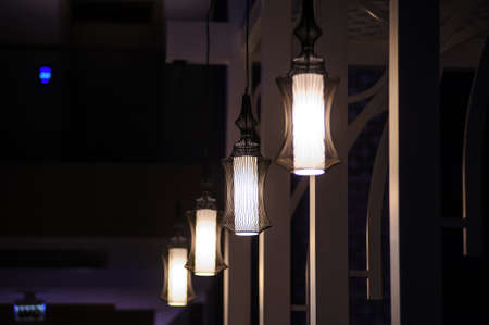 chandelier light in night in a restaurant during vacationの写真素材